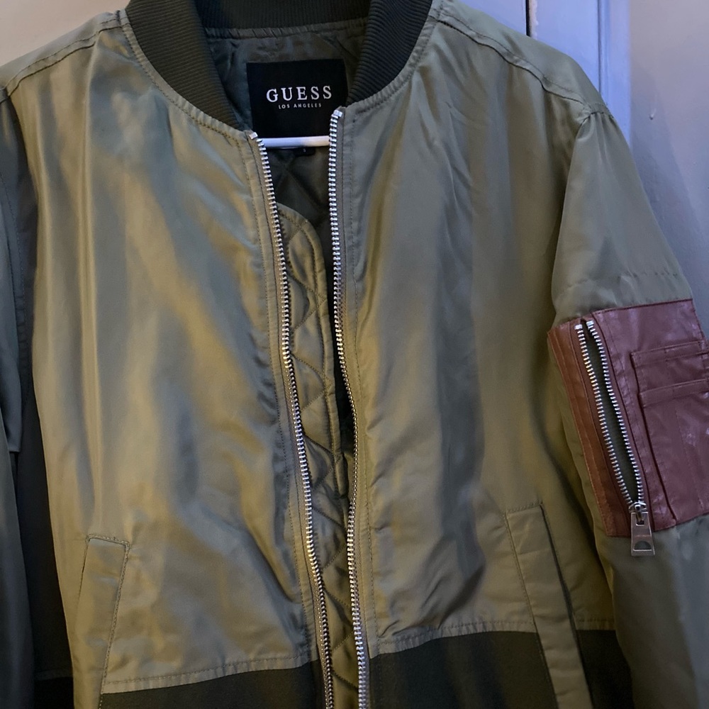 This is a green Guess bomber jacket, size small